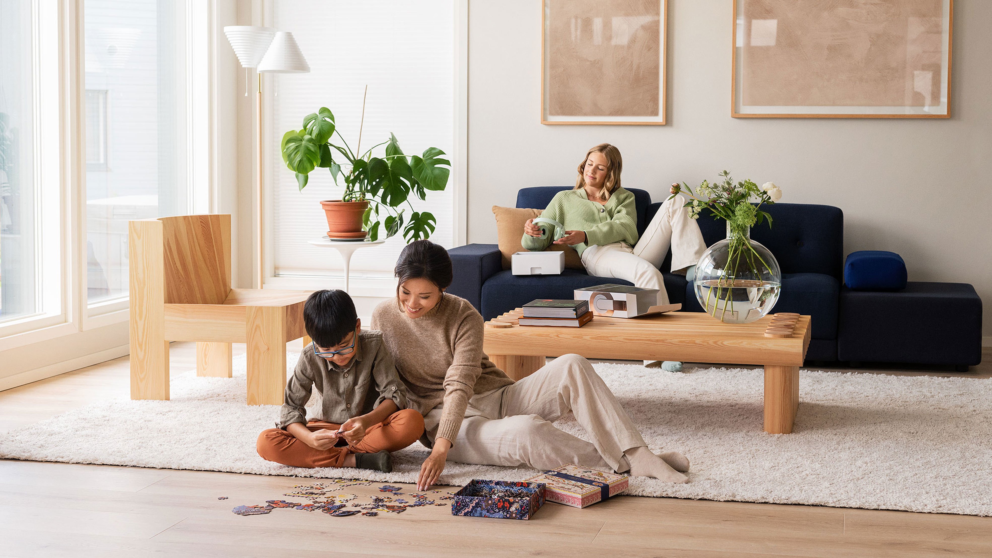 Children with parent doing the puzzle