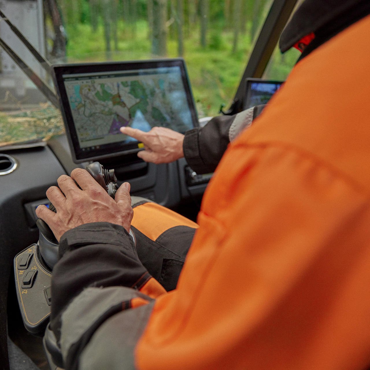 A forest machine operator in the forest machine’s cabin.