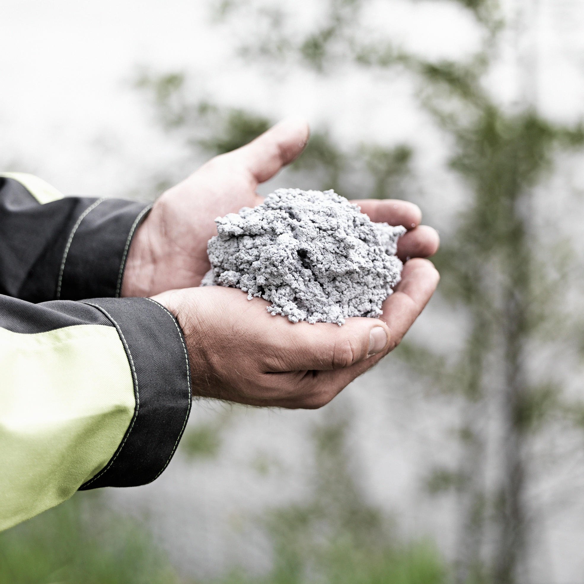 person holding recycled fibre mass